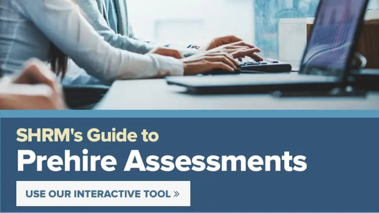 people working on laptops with the text SHRM's Guide to Prehire Assessments below